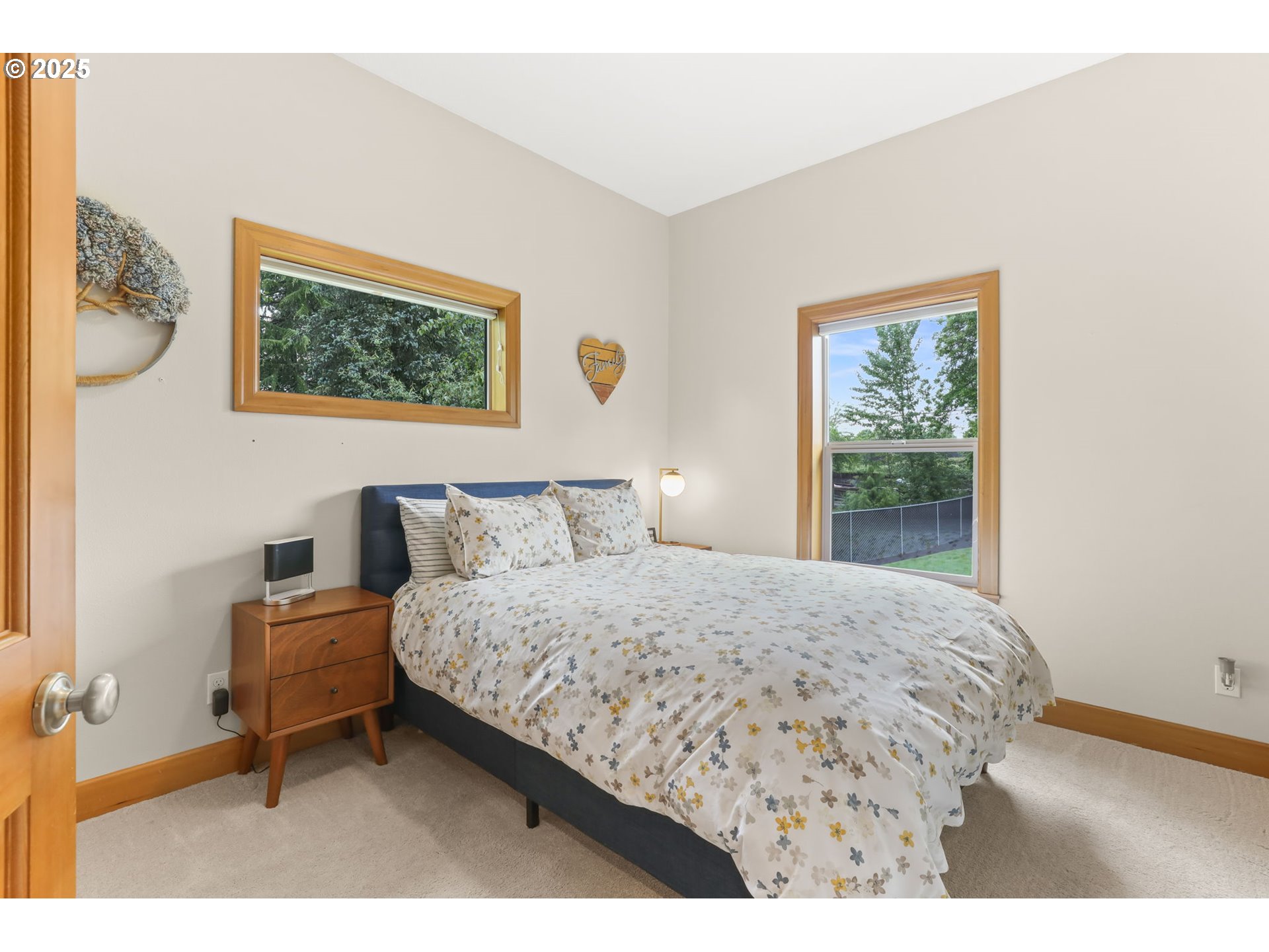 8443 Southeast Orient Drive Gresham, OR 97080 - Photo 20 of 48 a bedroom with a bed and a painting on the wall