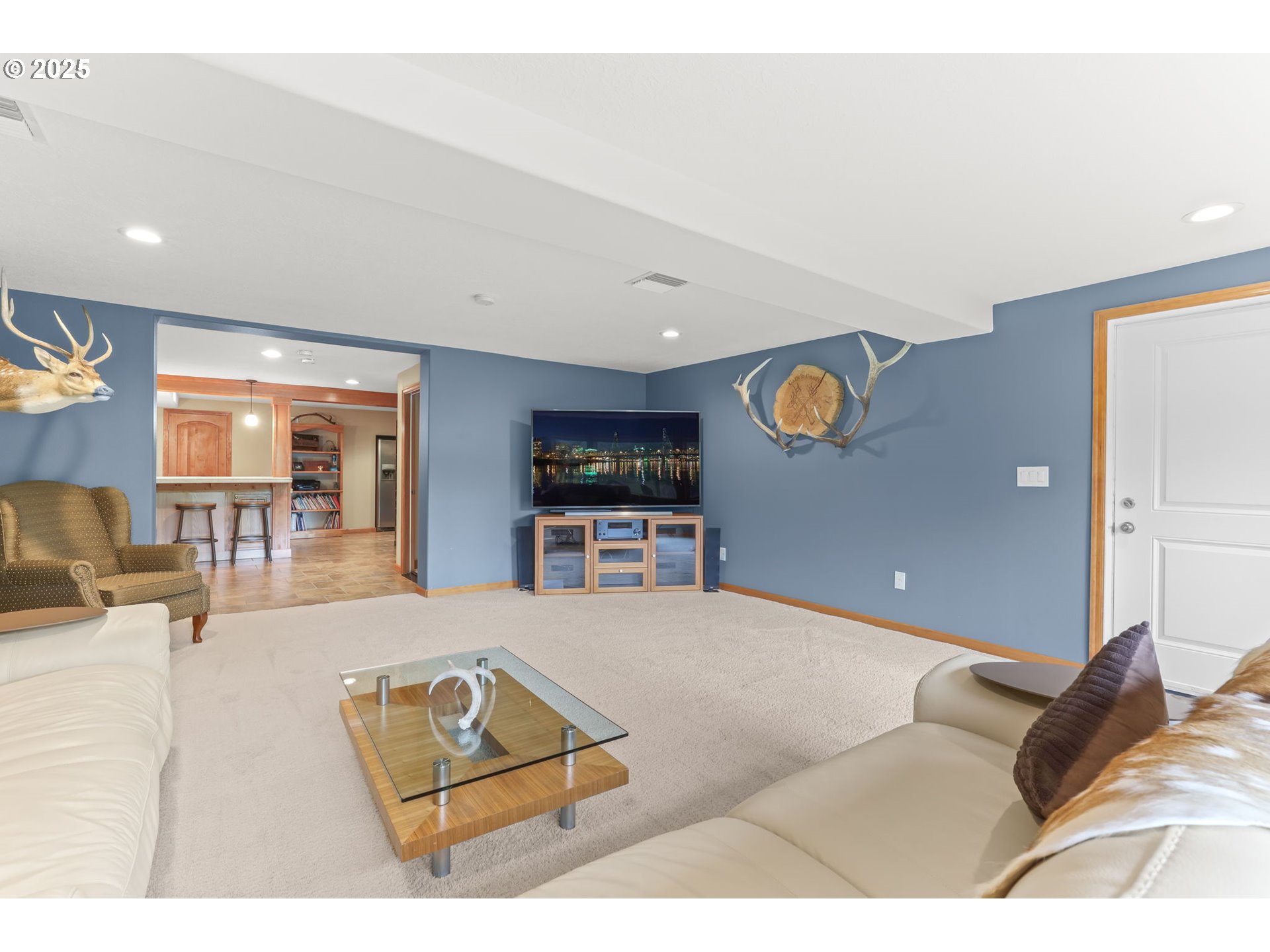 8443 Southeast Orient Drive Gresham, OR 97080 - Photo 30 of 48 a living room with furniture and a flat screen tv