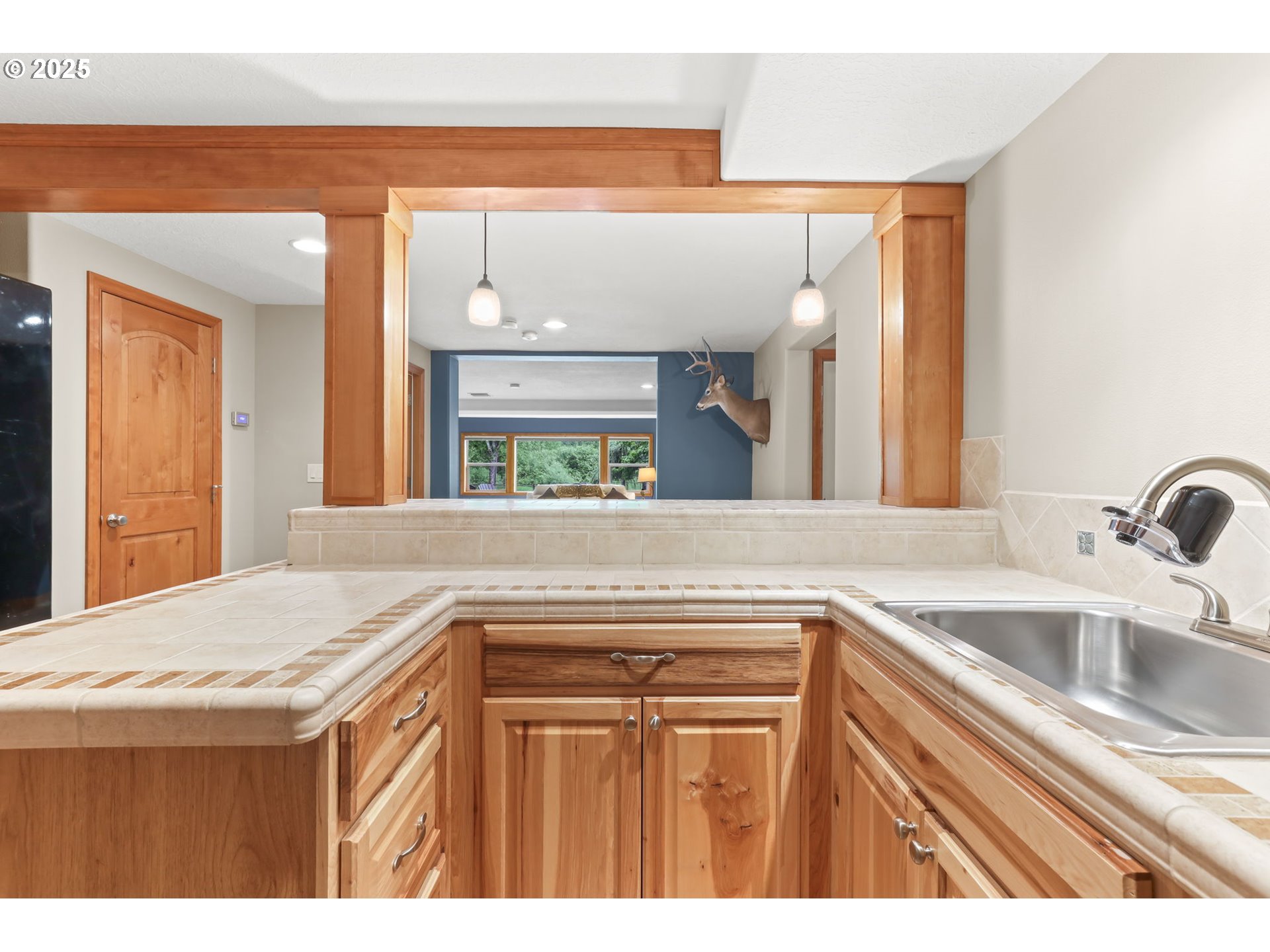 8443 Southeast Orient Drive Gresham, OR 97080 - Photo 32 of 48 a kitchen with a sink and a refrigerator