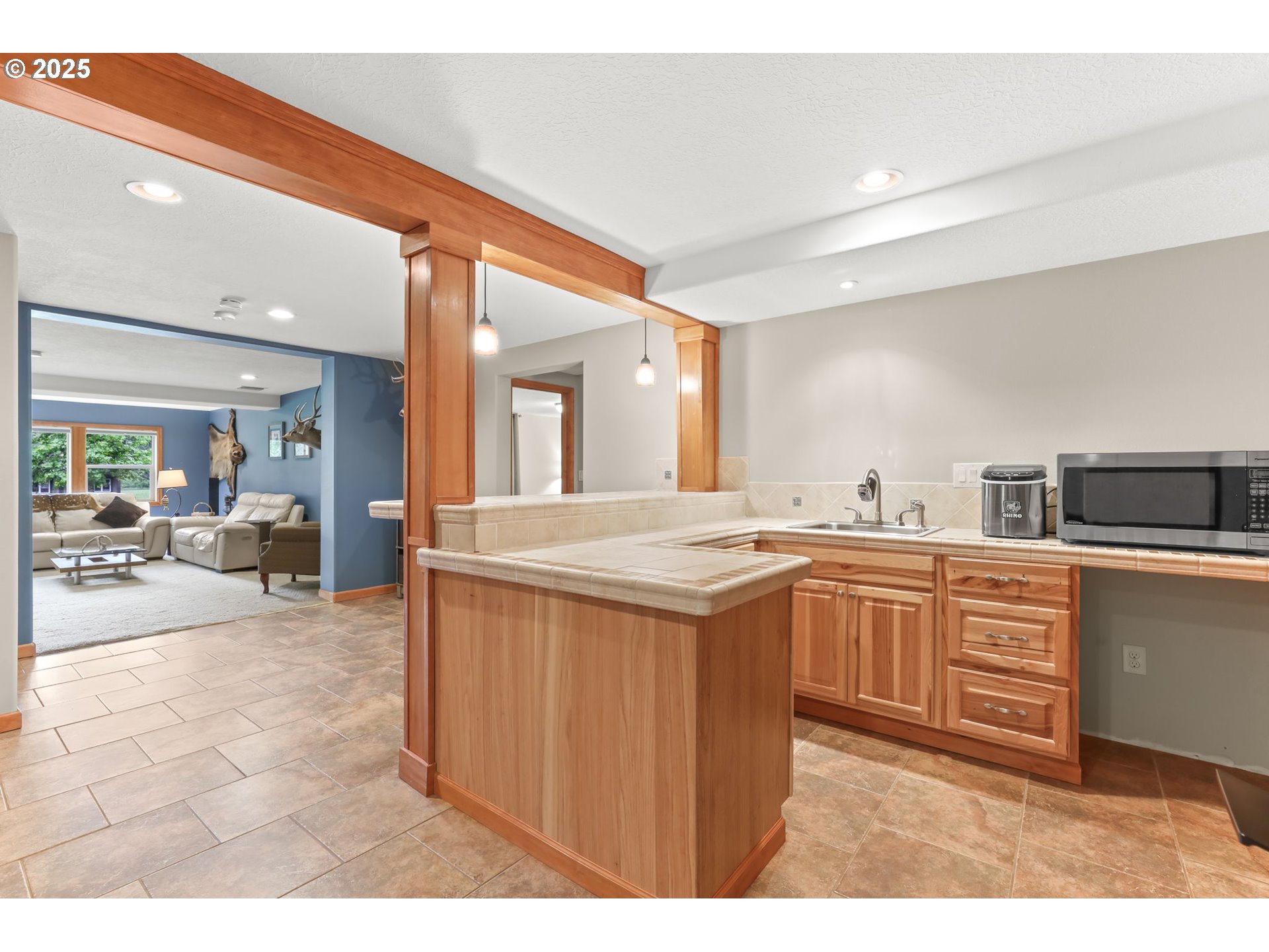 8443 Southeast Orient Drive Gresham, OR 97080 - Photo 33 of 48 a large bathroom with a sink a large mirror and a view of living room