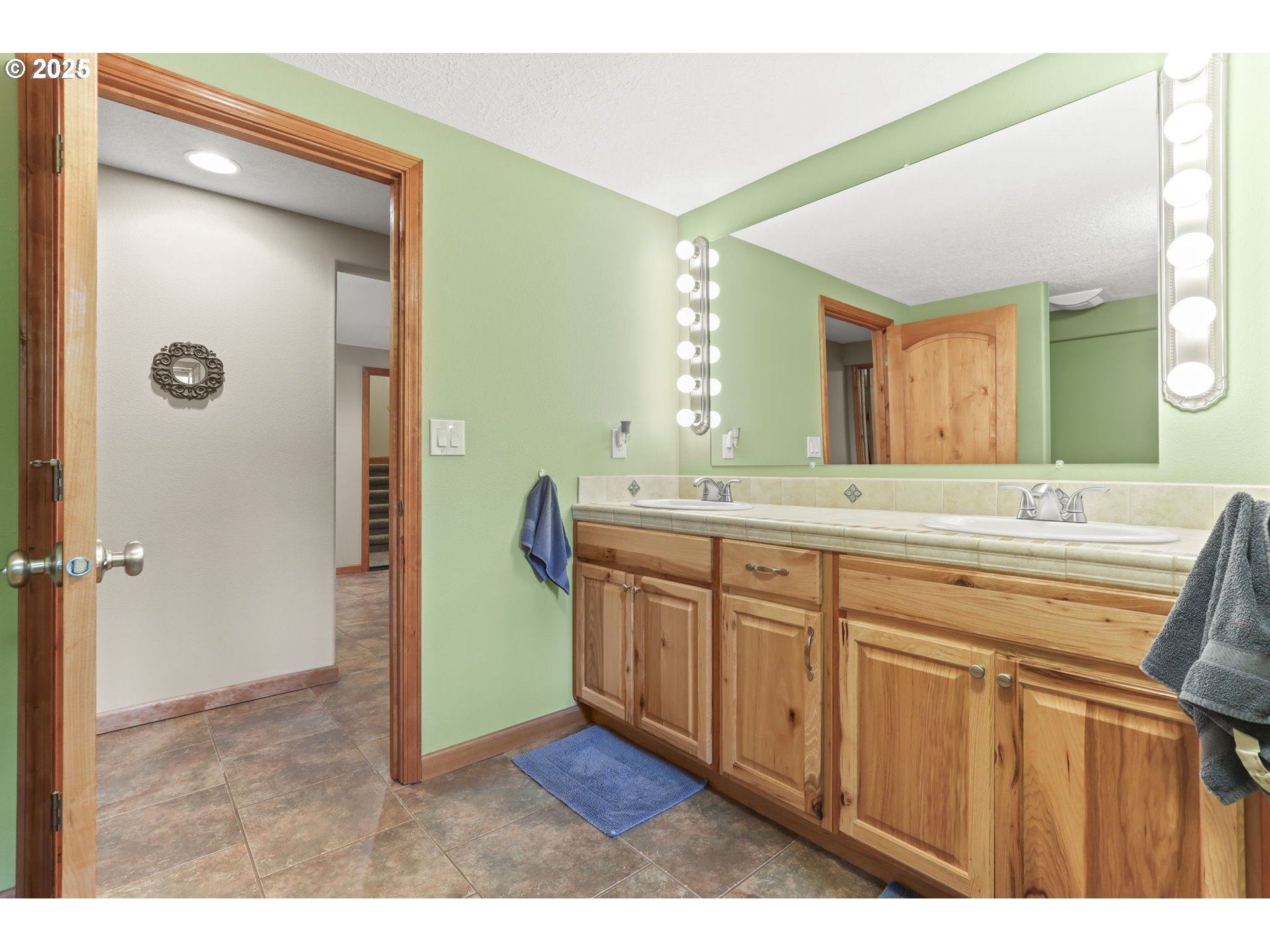 8443 Southeast Orient Drive Gresham, OR 97080 - Photo 39 of 48 a bathroom with a granite countertop sink mirror and a