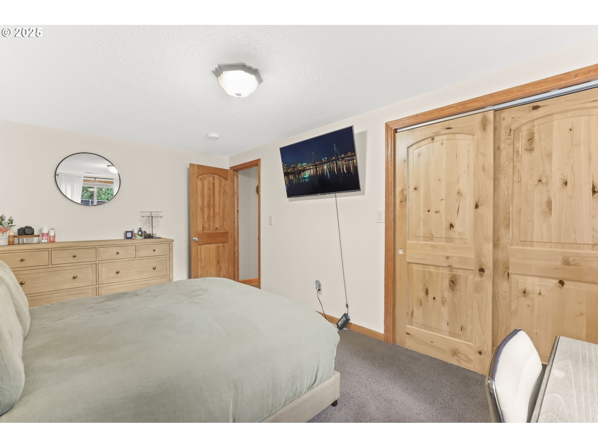 8443 Southeast Orient Drive Gresham, OR 97080 - Photo 41 of 48 a bedroom with a bed and a flat screen tv