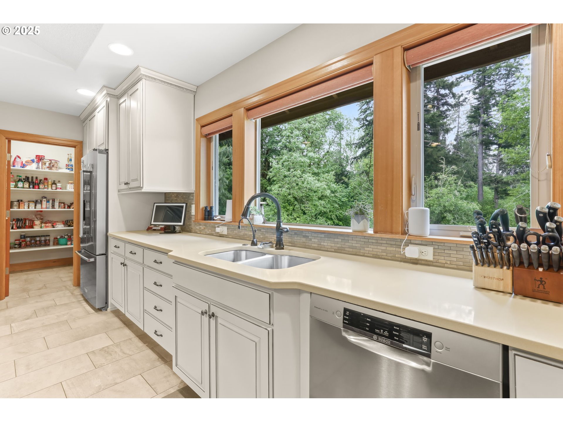 8443 Southeast Orient Drive Gresham, OR 97080 - Photo 8 of 48 a kitchen with a sink stove and cabinets