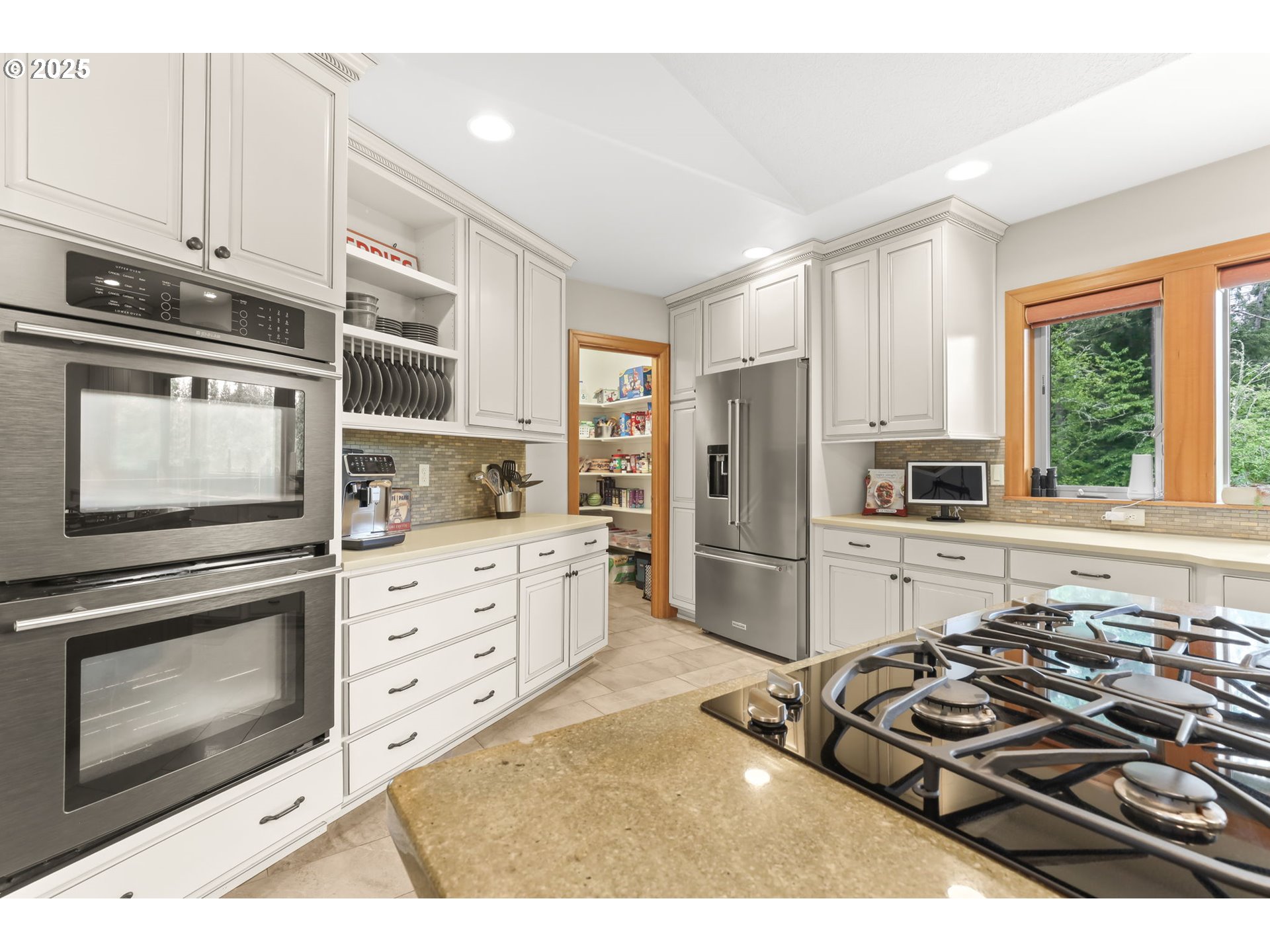 8443 Southeast Orient Drive Gresham, OR 97080 - Photo 10 of 48 a kitchen with a stove a sink and a refrigerator