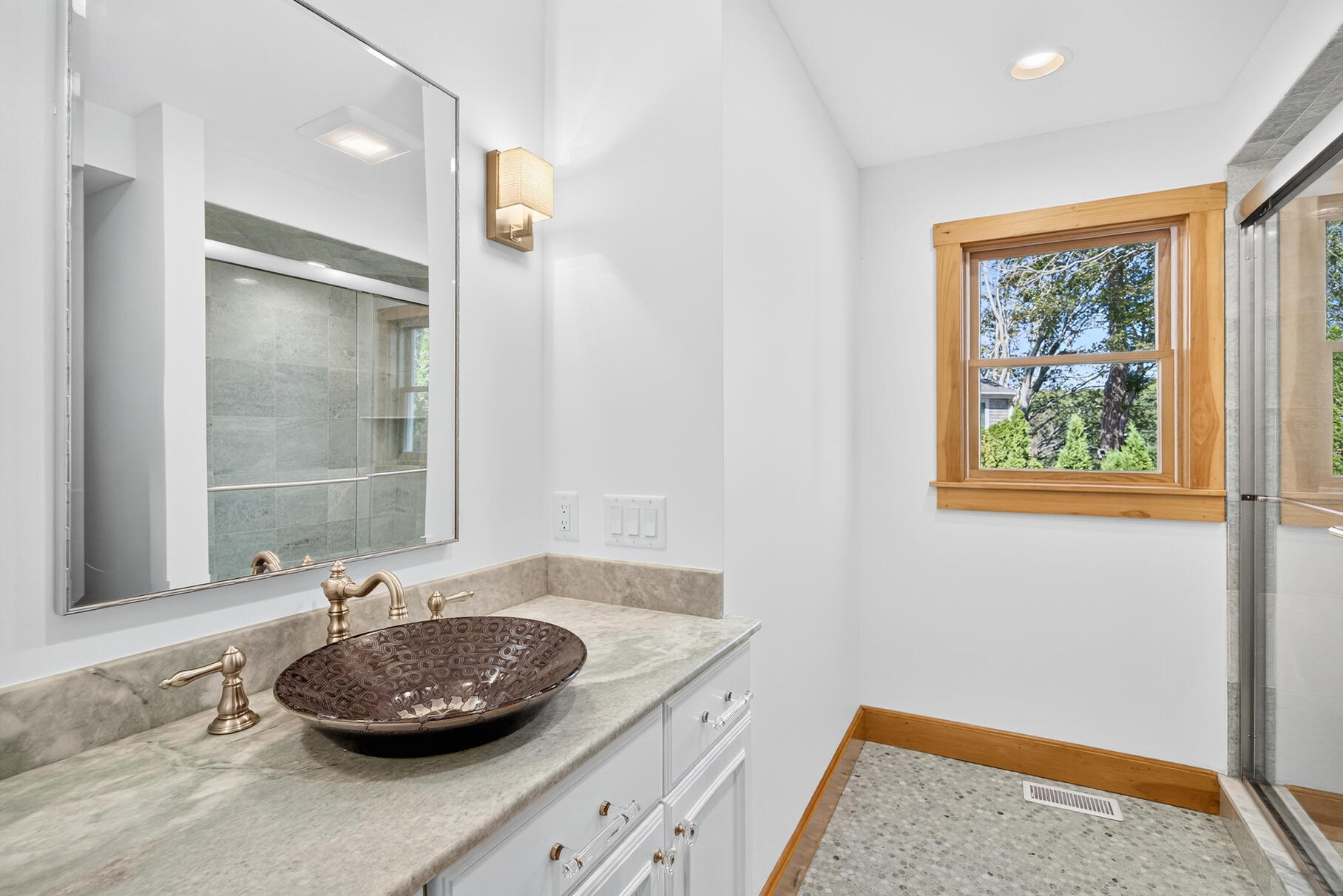 131 Timberlane Drive Mashpee, MA 02649 - Photo 35 of 57 a bathroom with a granite countertop sink and a mirror