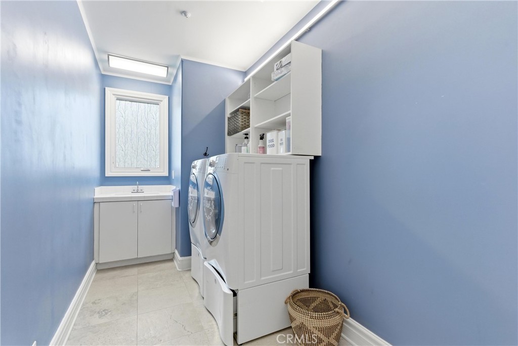 29131 Bouquet Canyon Road Silverado, CA 92676 - Photo 41 of 74 1st floor laundry room with storage cabinets and counter space
