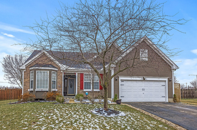 2904 Arbor Lane Aurora, IL 60502 - Photo 1 of 23 a front view of a house with a garden