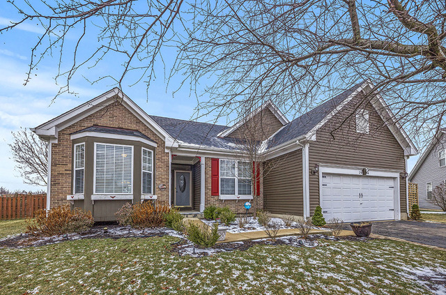 2904 Arbor Lane Aurora, IL 60502 - Photo 2 of 23 a front view of a house with a yard
