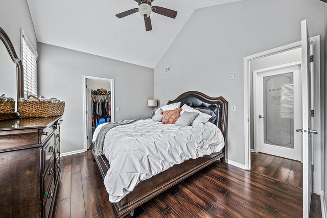 2904 Arbor Lane Aurora, IL 60502 - Photo 11 of 23 a bedroom with a bed and wooden floor