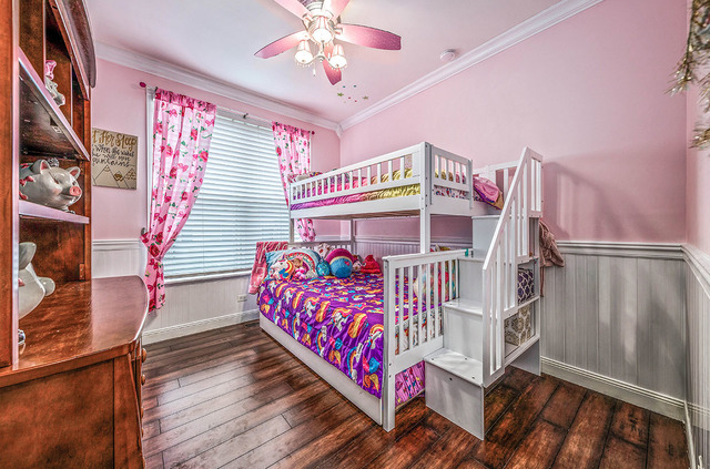 2904 Arbor Lane Aurora, IL 60502 - Photo 15 of 23 a bedroom with furniture and a chandelier