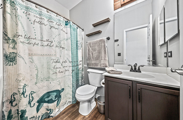 2904 Arbor Lane Aurora, IL 60502 - Photo 17 of 23 a bathroom with a sink and a mirror