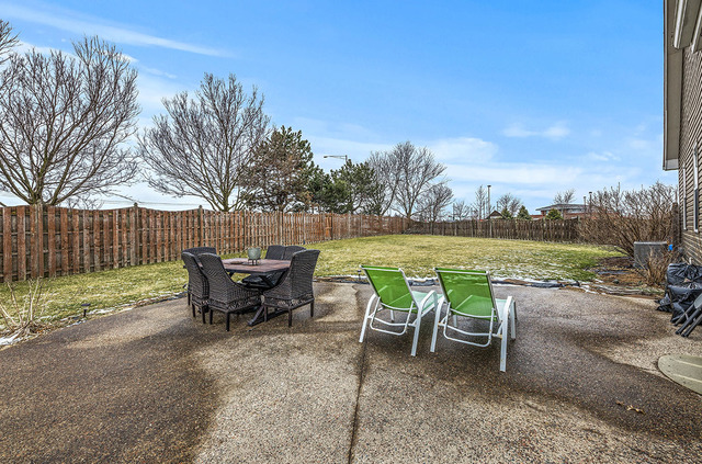 2904 Arbor Lane Aurora, IL 60502 - Photo 19 of 23 a view of a lake with outdoor seating space