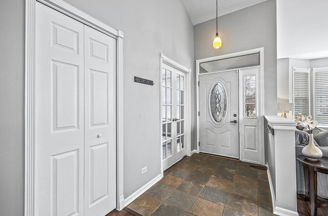 2904 Arbor Lane Aurora, IL 60502 - Photo 3 of 23 a view of a hallway with bathroom and front door