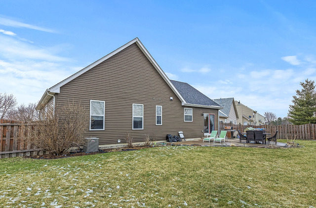 2904 Arbor Lane Aurora, IL 60502 - Photo 21 of 23 a backyard of a house with table and chairs