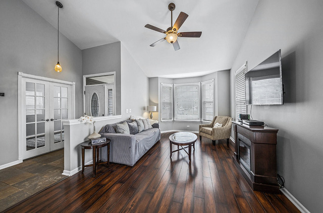 2904 Arbor Lane Aurora, IL 60502 - Photo 5 of 23 a living room with furniture and a wooden floor