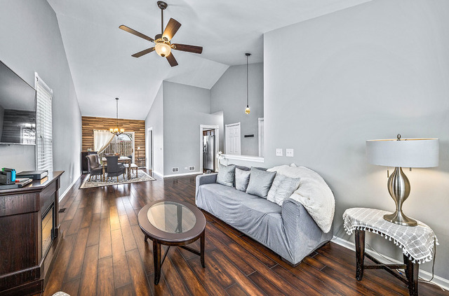 2904 Arbor Lane Aurora, IL 60502 - Photo 6 of 23 a living room with furniture a rug potted plant and a large window