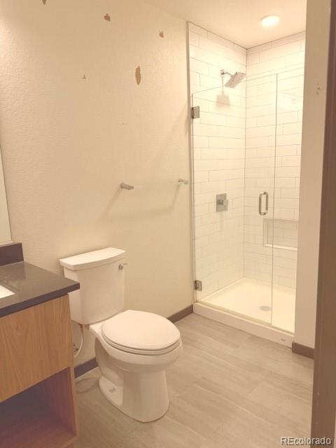 603 Inca Street, Unit 309 Denver, CO 80204 - Photo 11 of 12 a white toilet sitting next to a bathroom sink
