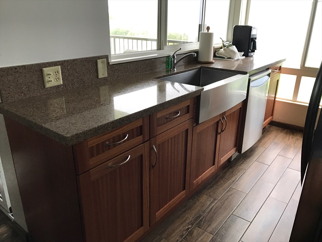 3811 Edward Road, Unit 8204 Princeville, HI 96722 - Photo 4 of 16 a kitchen with a sink and a stove top oven