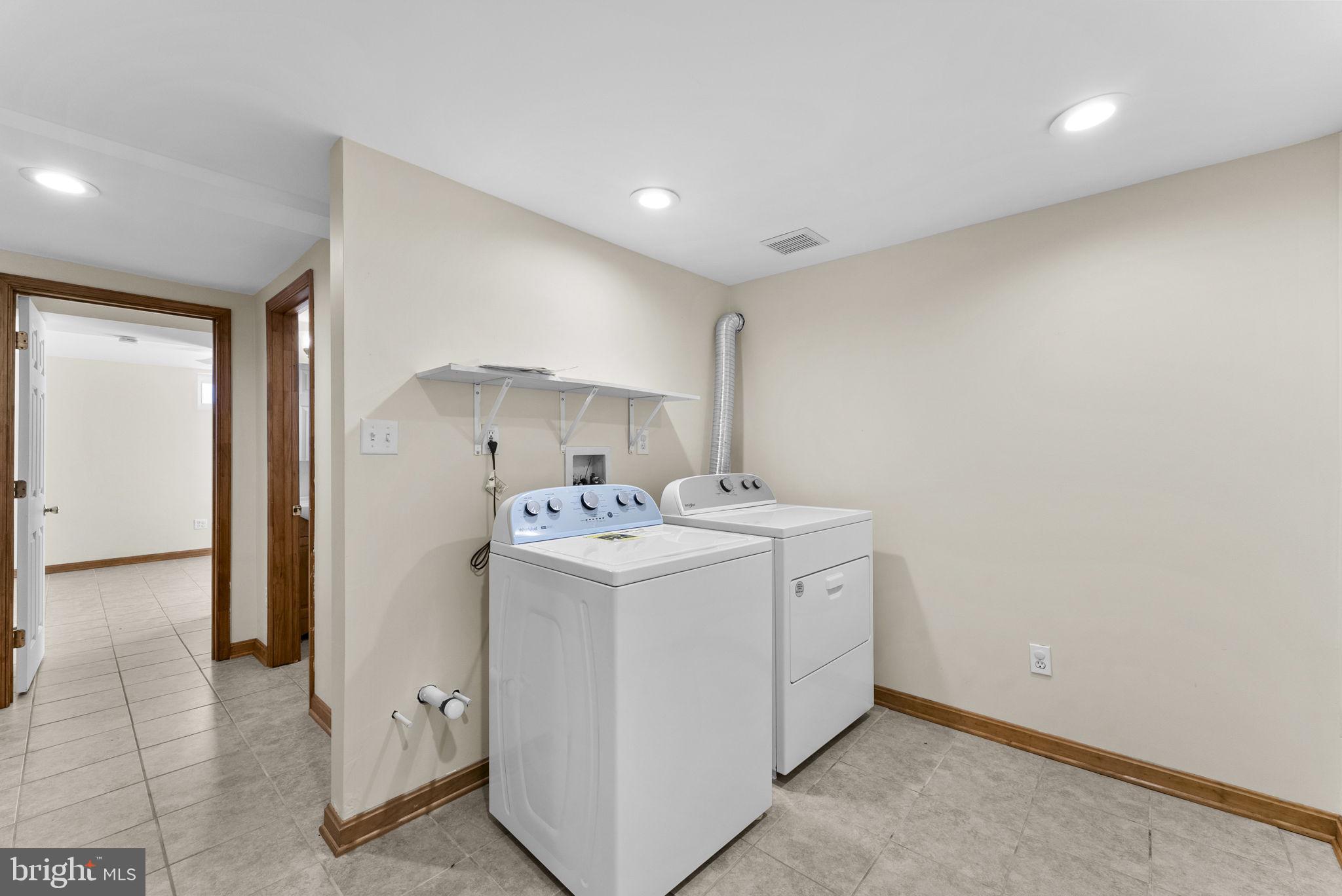 539 Old Meetze Road Warrenton, VA 20186 - Photo 25 of 30 a utility room with dryer and washer