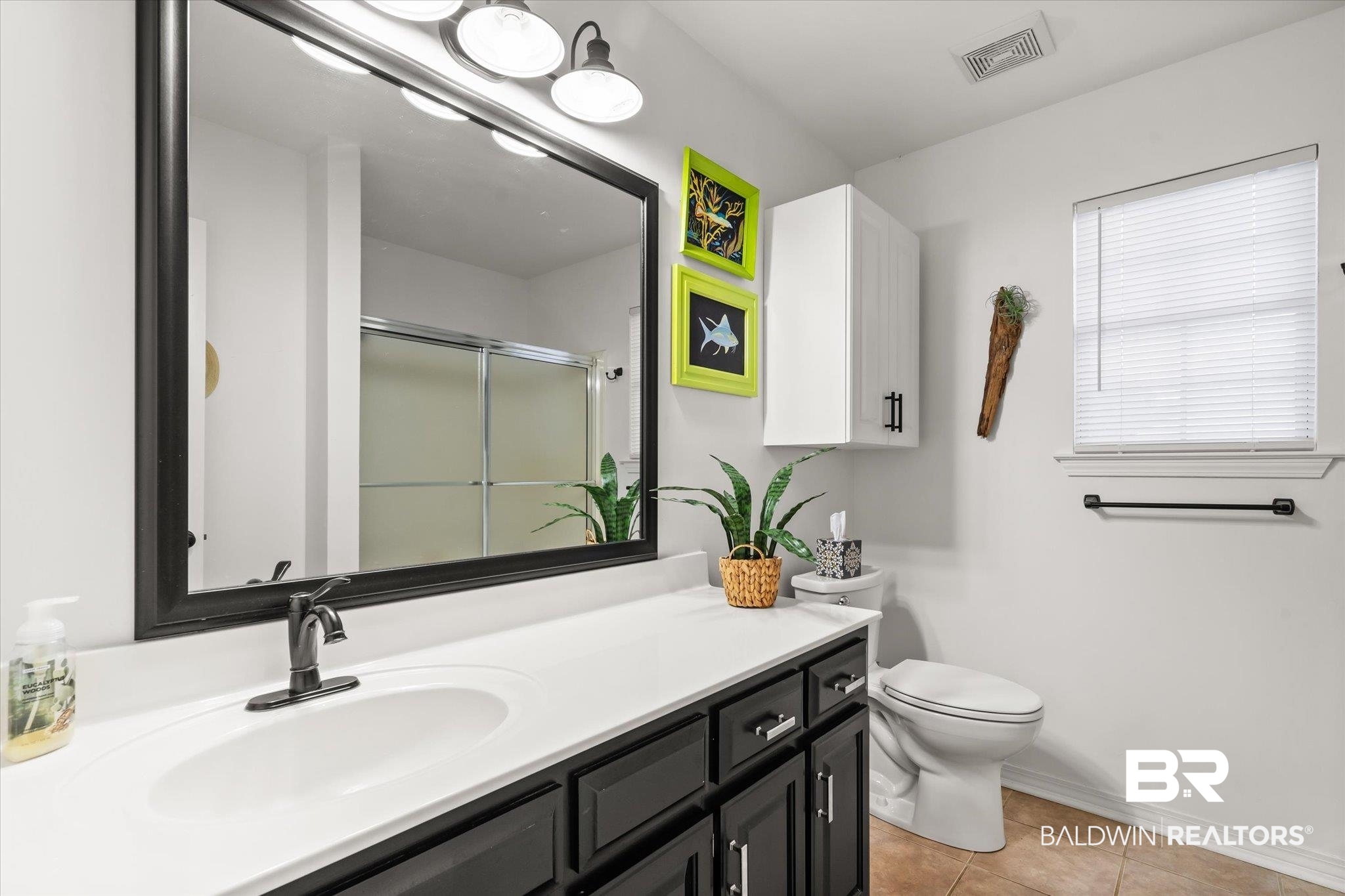 19924 Hunters Loop Fairhope, AL 36532 - Photo 23 of 40 Bathroom featuring tile patterned flooring, vanity, toilet, and walk in shower