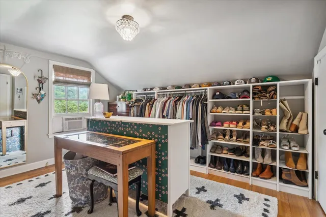 a view of a dining room with furniture and a window