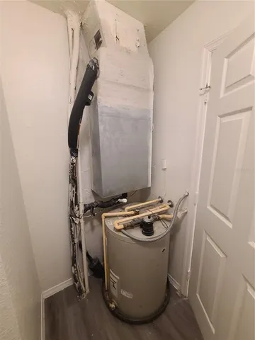 a view of a hallway to rooms