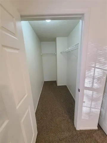 a bathroom with a sink toilet and a mirror