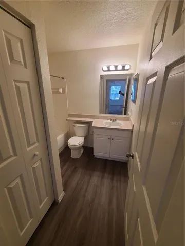 a bathroom with a toilet and a bathtub
