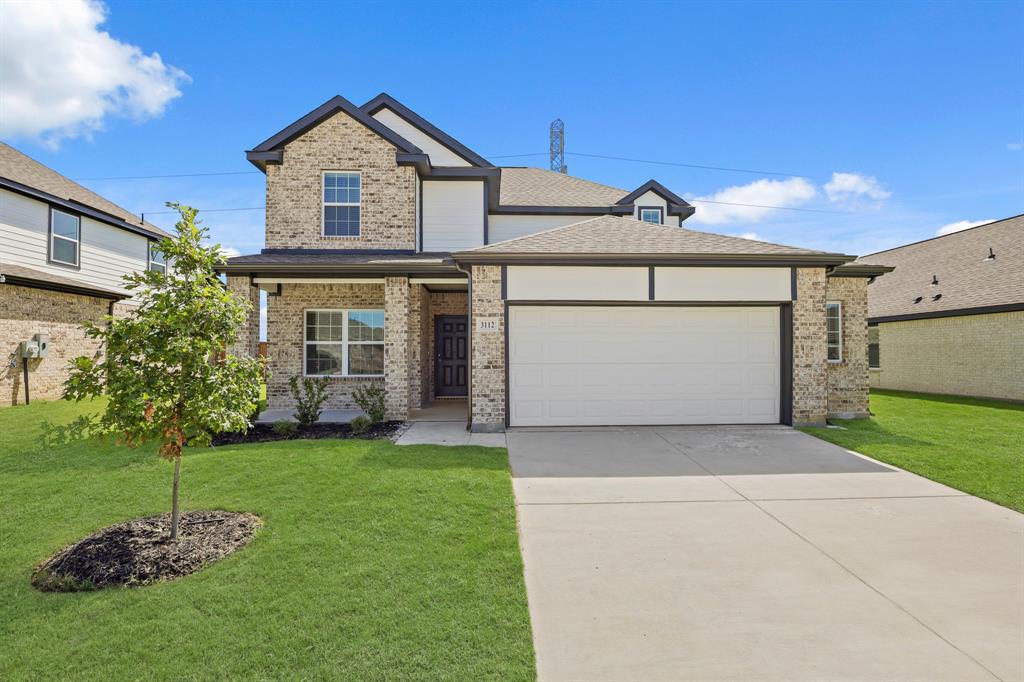 3112 Harmony Way Cleburne, TX 76031 - Photo 1 of 25 a front view of a house with a yard and garage