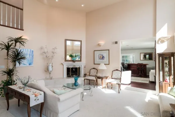 a living room with furniture and a lamp