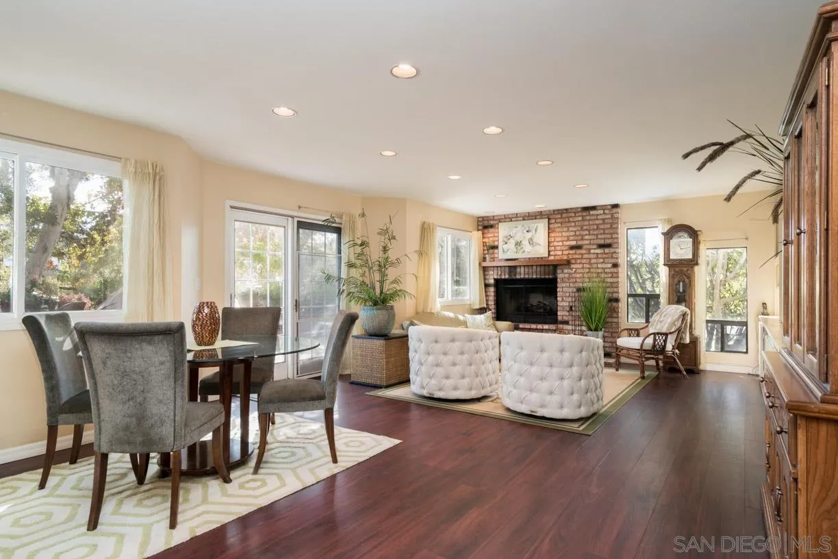 2310 Cordero Road Del Mar, CA 92014 - Photo 9 of 25 a living room with fireplace furniture and a large window