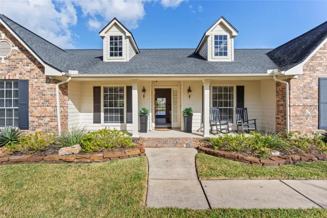 a front view of a house with garden