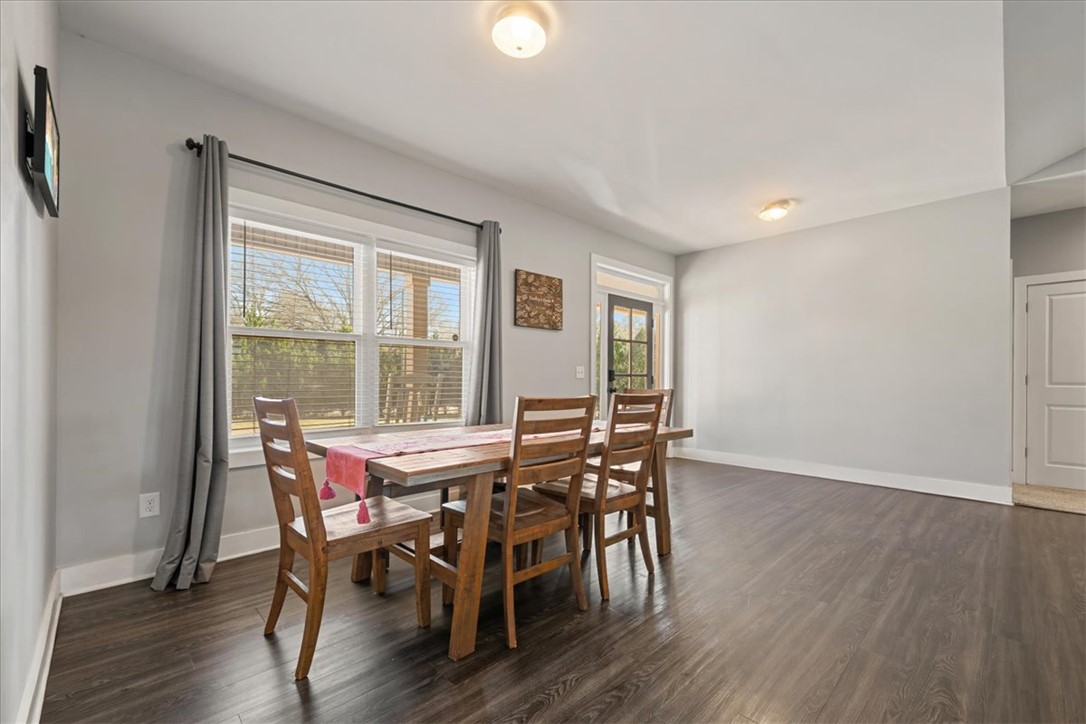 212 Winding Lane Seneca, SC 29672 - Photo 12 of 47 This bright dining area offers ample space for gatherings and everyday meals.