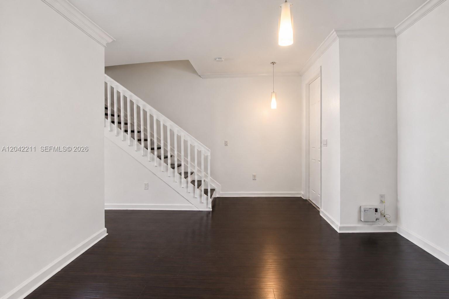 8954 West 35th Way Hialeah, FL 33018 - Photo 5 of 24 a view of entryway with wooden floor