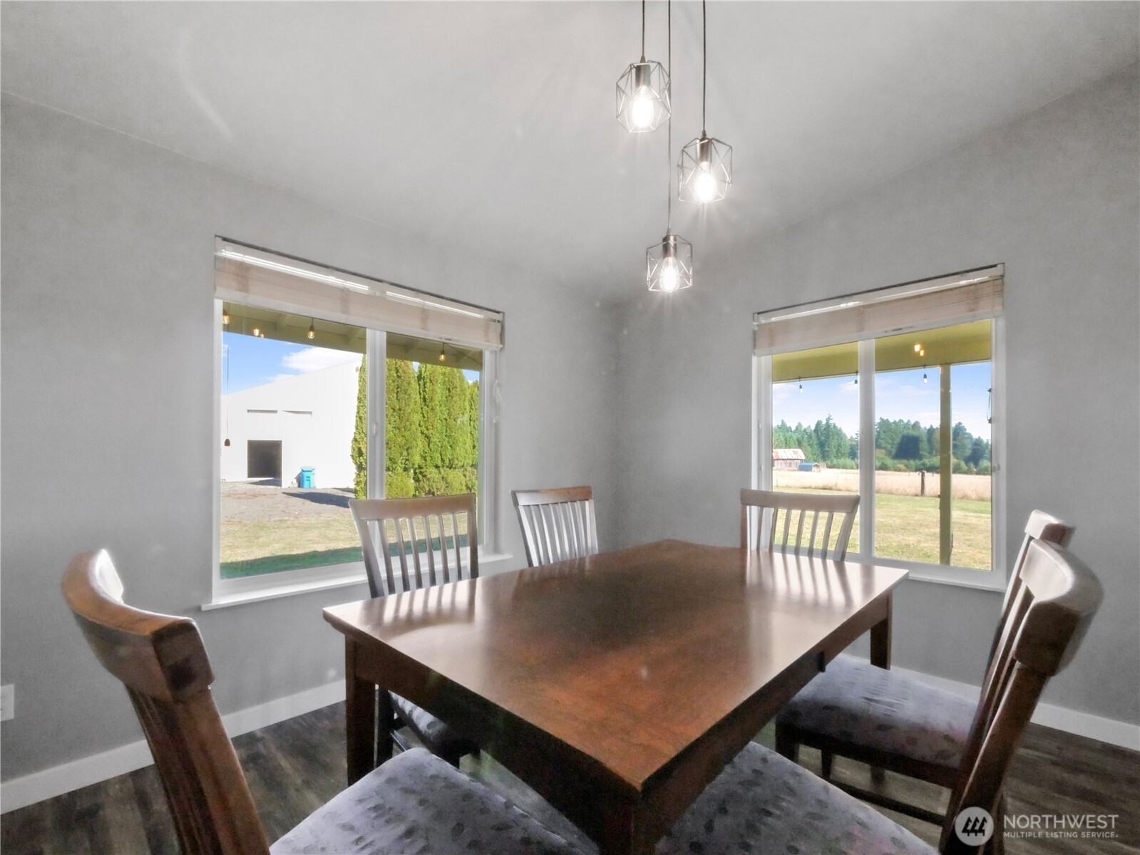 219 Jones Road Winlock, WA 98596 - Photo 15 of 35 a view of a dining room with furniture a chandelier and wooden floor