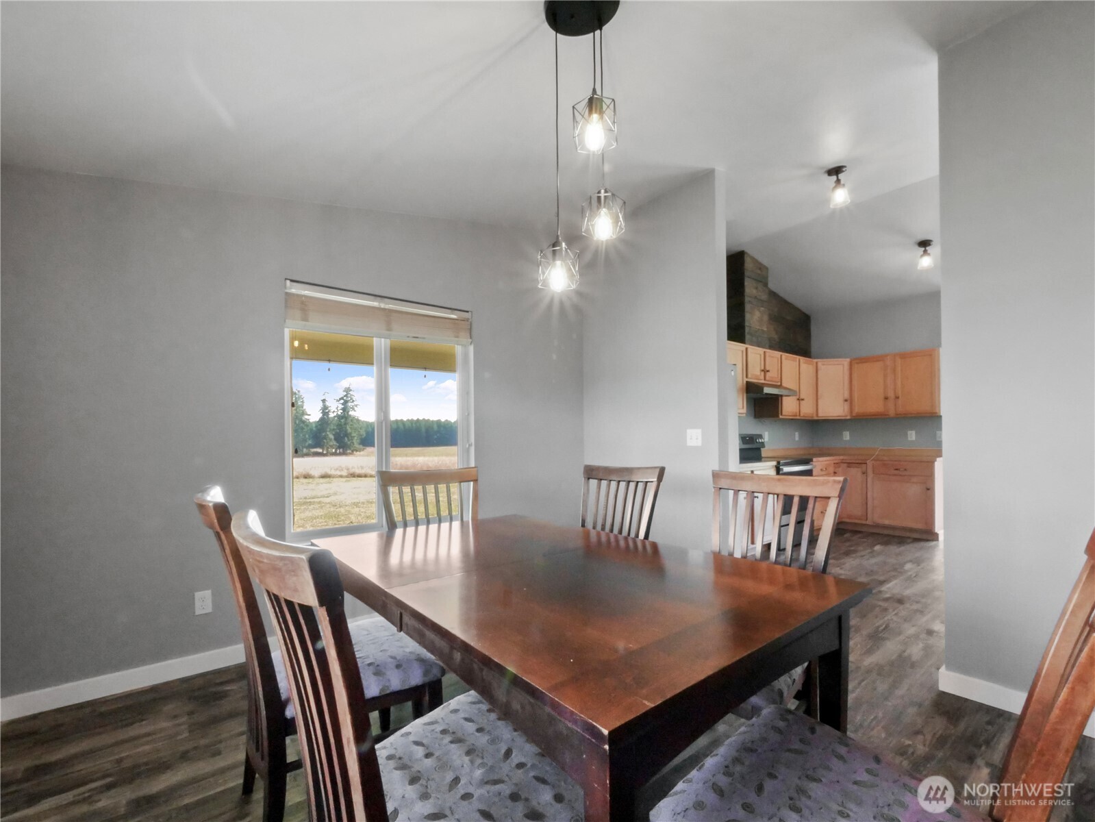 219 Jones Road Winlock, WA 98596 - Photo 16 of 35 a view of a dining room with furniture and wooden floor