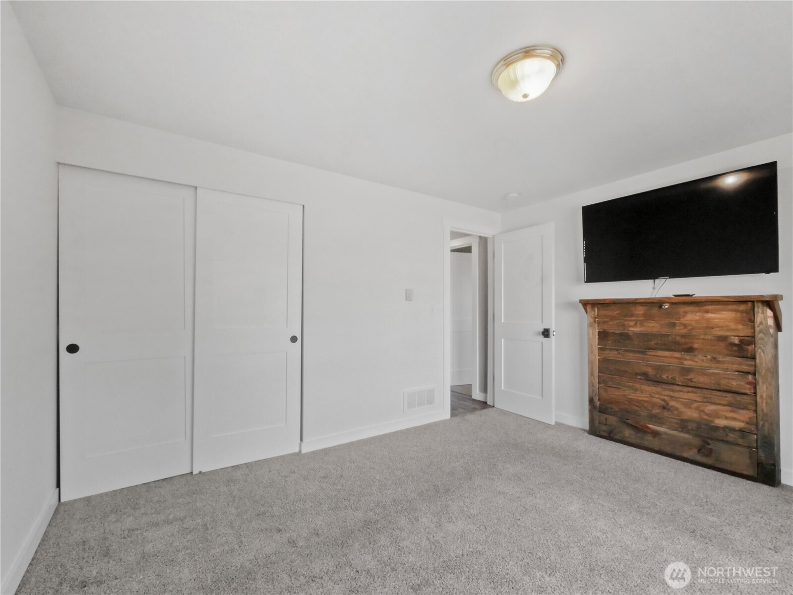 219 Jones Road Winlock, WA 98596 - Photo 17 of 35 a view of an empty room with furniture and a flat screen tv