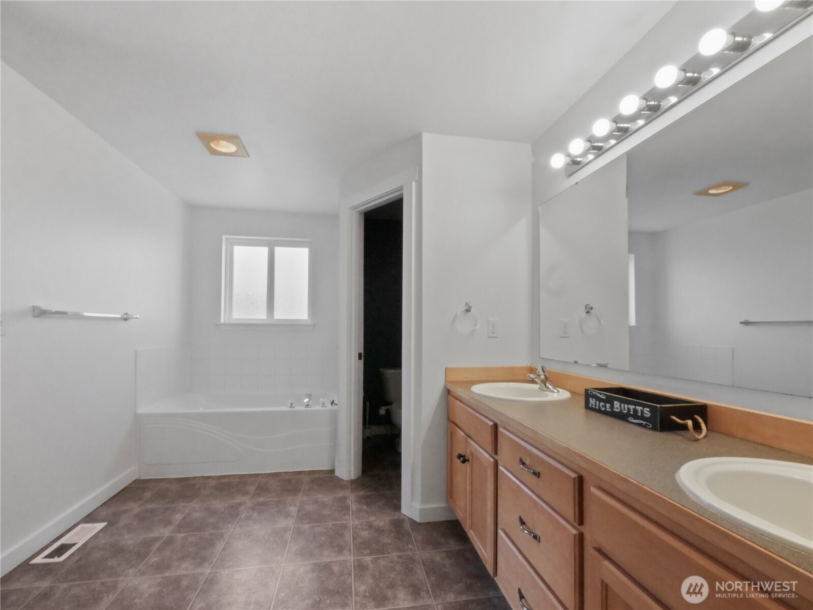 219 Jones Road Winlock, WA 98596 - Photo 22 of 35 a bathroom with a sink double vanity granite tub and a mirror