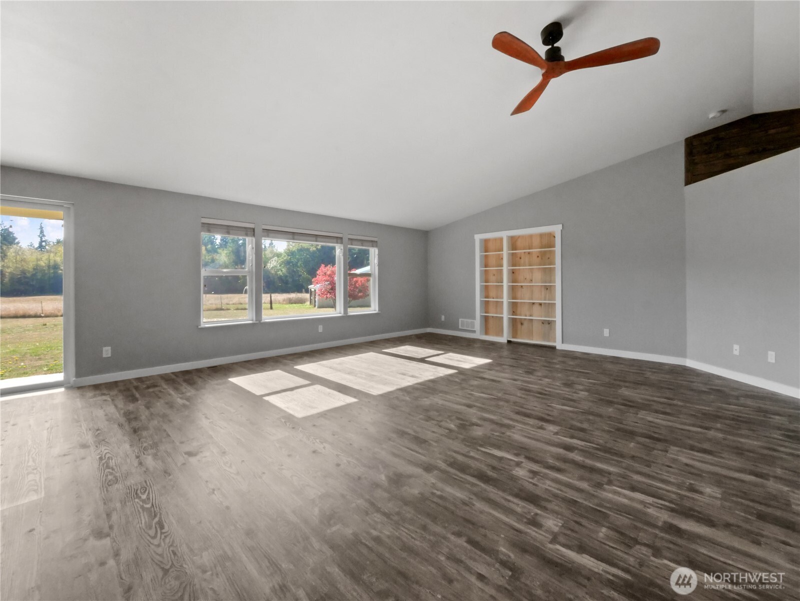 219 Jones Road Winlock, WA 98596 - Photo 8 of 35 wooden floor in an empty room with a window