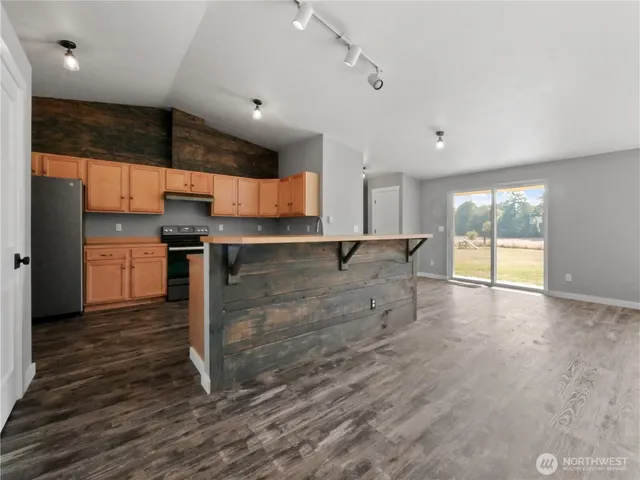 a view of a kitchen with a sink and cabinets