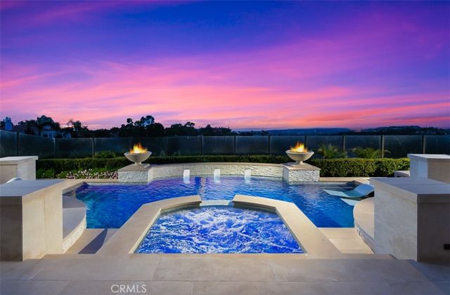 a view of a patio with couches and city view