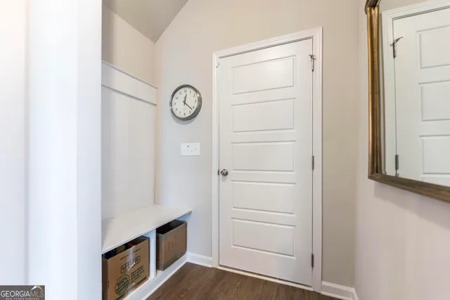 a view of an entryway with wooden floor