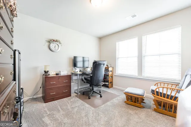 a bedroom with furniture and a window