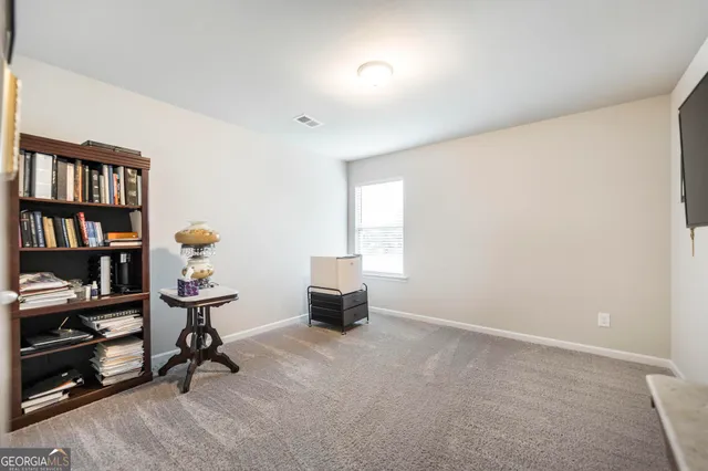 a room with furniture and a book shelf