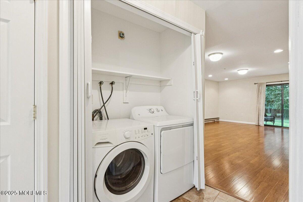 70 Overlook Way, Unit E Manalapan, NJ 07726 - Photo 16 of 21 a view of a hallway with washer and dryer