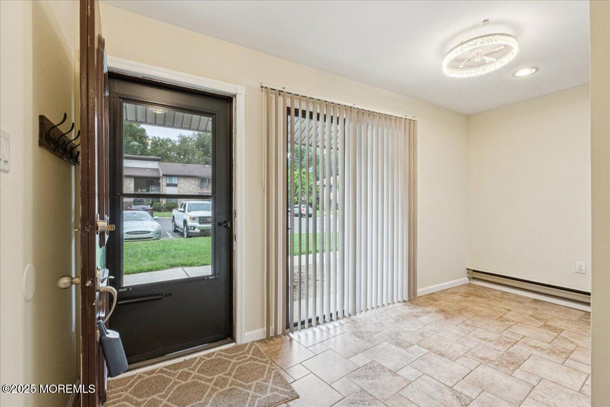 70 Overlook Way, Unit E Manalapan, NJ 07726 - Photo 7 of 21 a view of a room with a large window