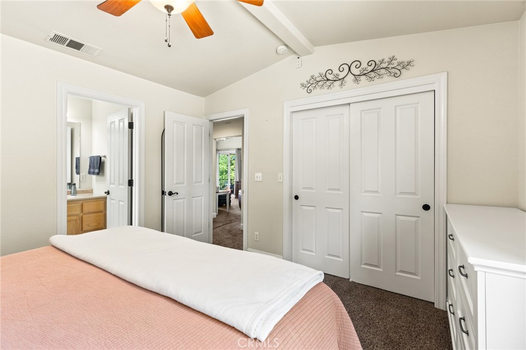 38 Kobe Loop Chico, CA 95973 - Photo 26 of 38 a spacious bedroom with a bed and a view of bathroom