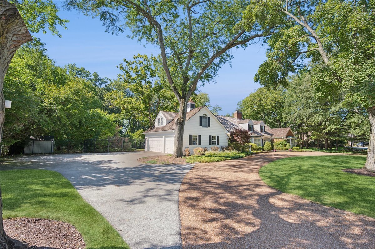 32 Meadowview Road Northfield, IL 60093 - Photo 3 of 69 a front view of a house with a yard and garage
