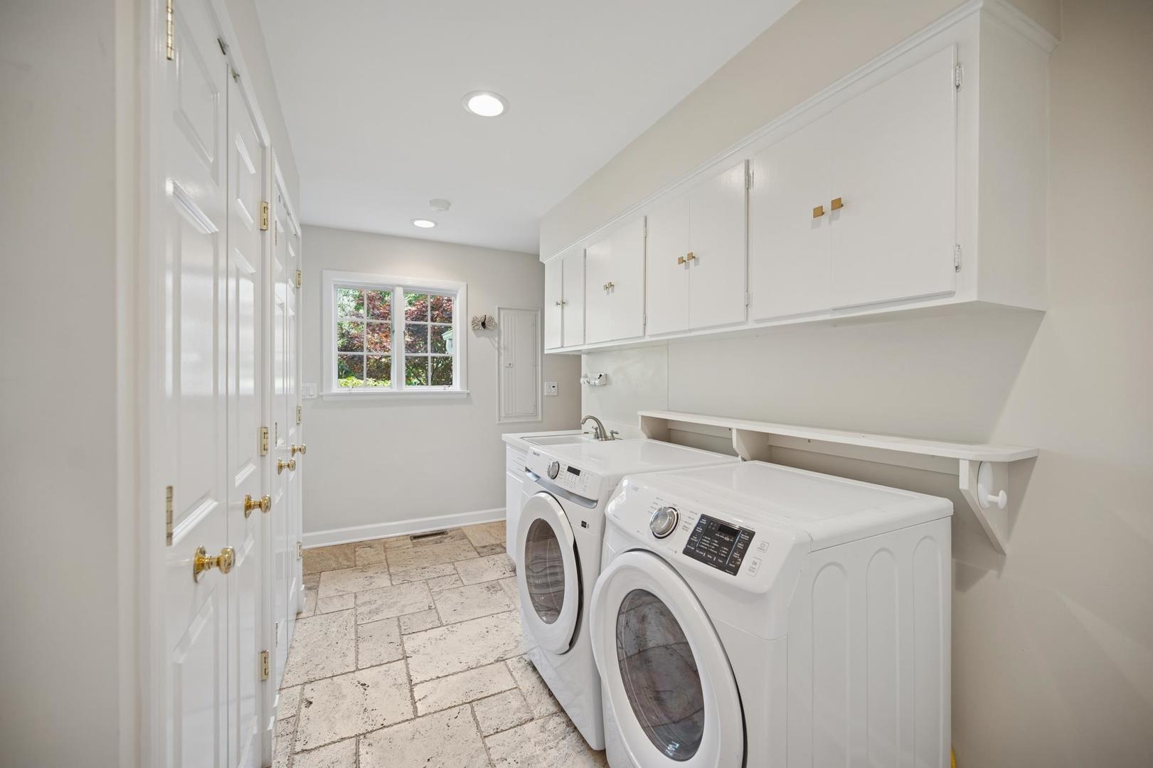 32 Meadowview Road Northfield, IL 60093 - Photo 38 of 69 a view of storage and utility room with washer and dryer