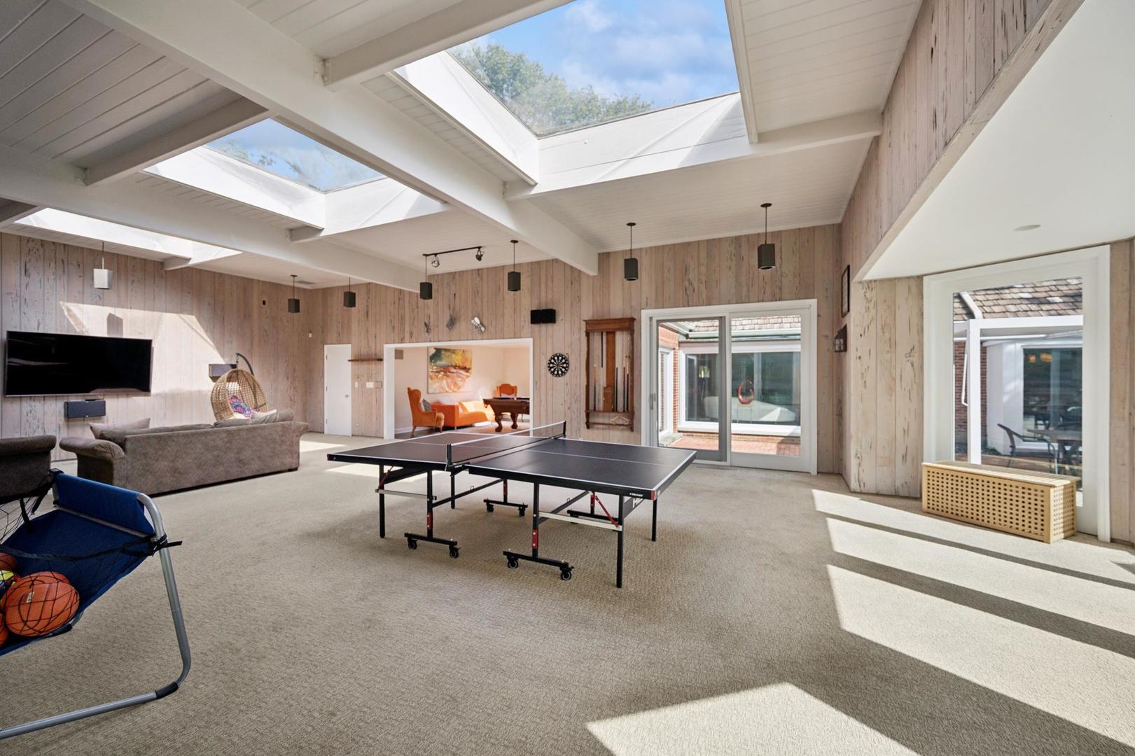 32 Meadowview Road Northfield, IL 60093 - Photo 39 of 69 a living room with furniture a flat screen tv and a large window